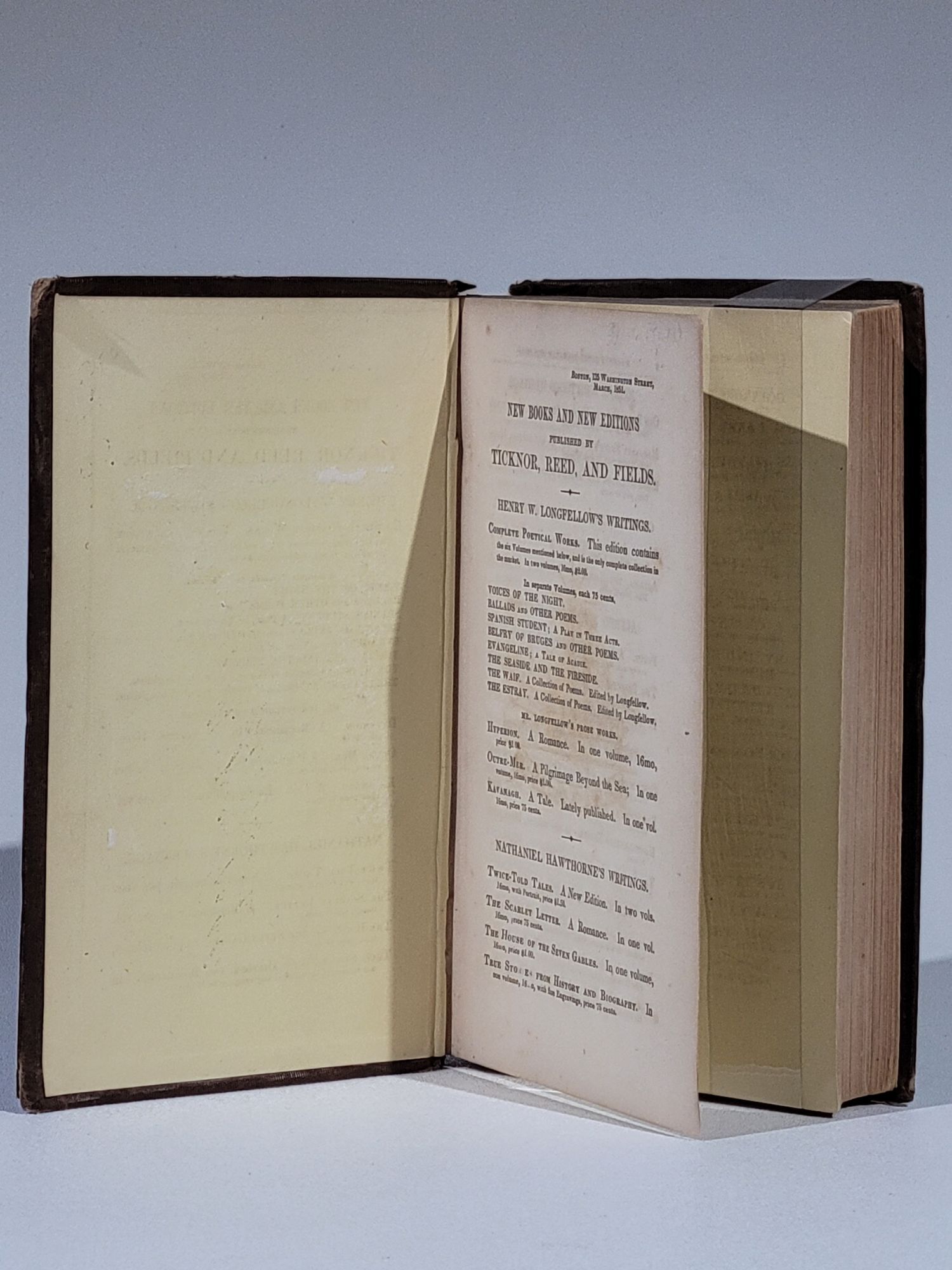 Old book cover showing a mysterious colonial mansion surrounded by fog