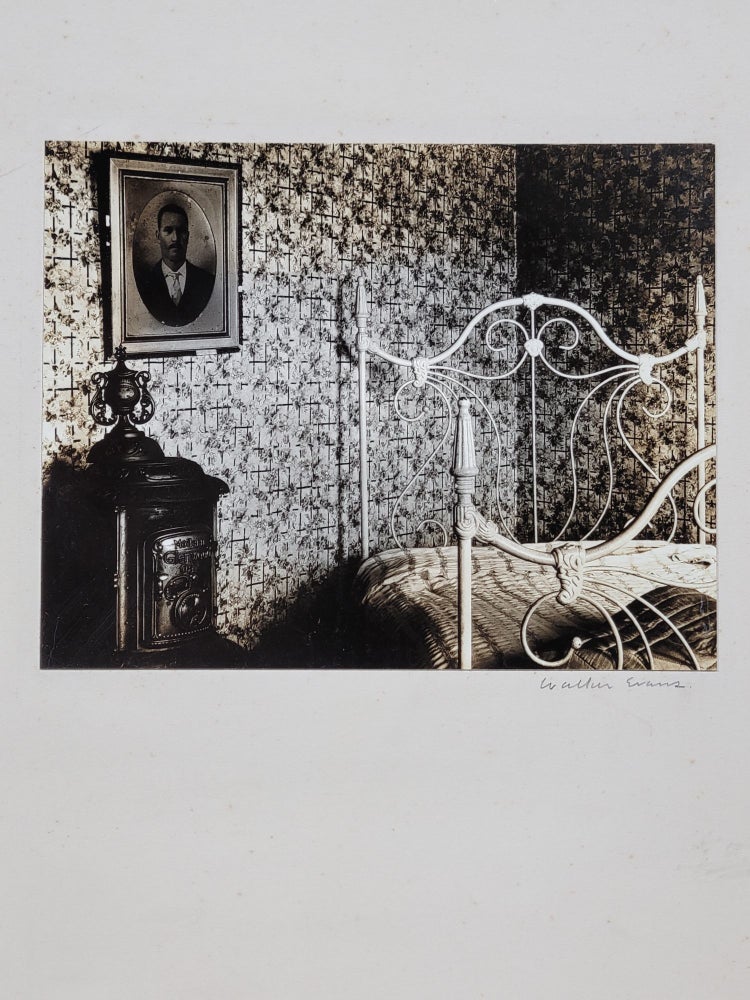 Item #584 Bed and Stove, Truro, Massachusetts. Interior, Cape Cod, 1931 (Signed photograph). Walker Evans.