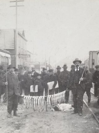 Item #674 1899 Photograph of Trout Fishermen with their Catch in Downtown Skagway, Alaska....