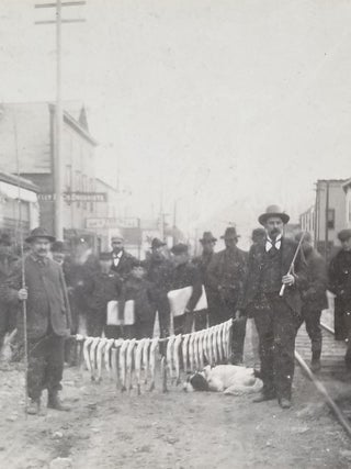 Item #674 1899 Photograph of Trout Fishermen with their Catch in Downtown Skagway, Alaska....