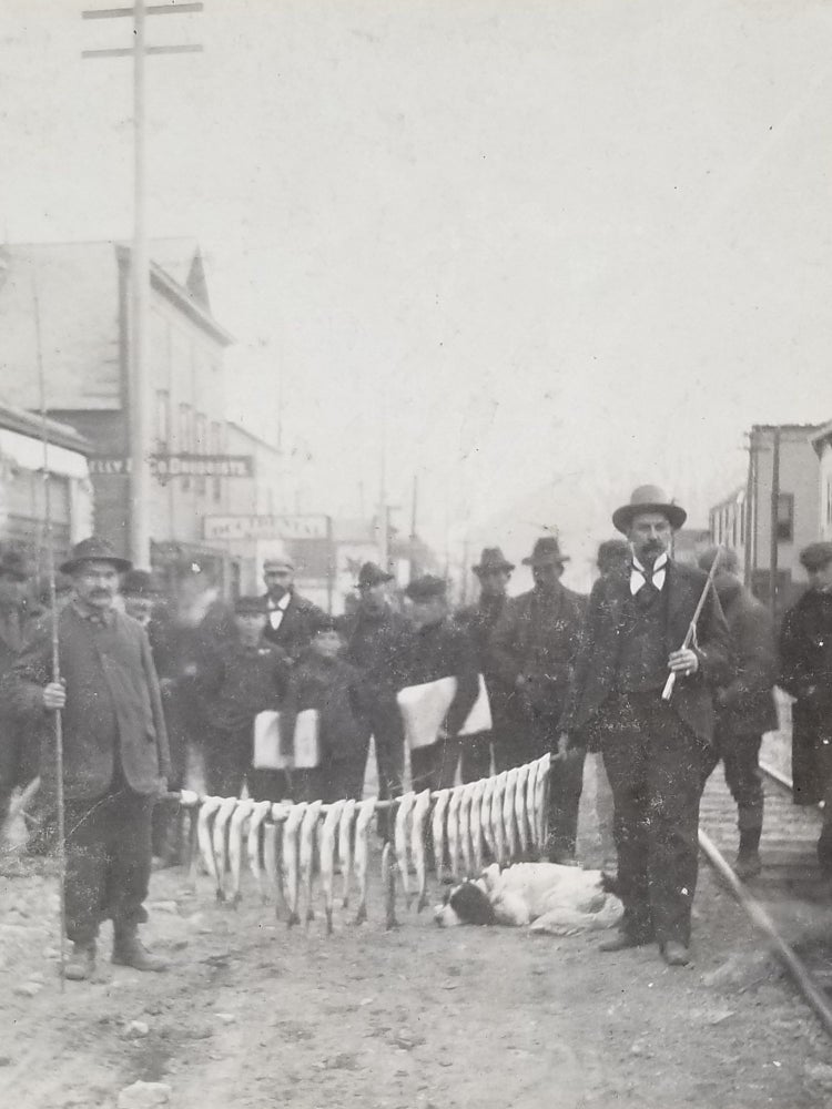 Item #674 1899 Photograph of Trout Fishermen with their Catch in Downtown Skagway, Alaska. Alaska, Klondike.